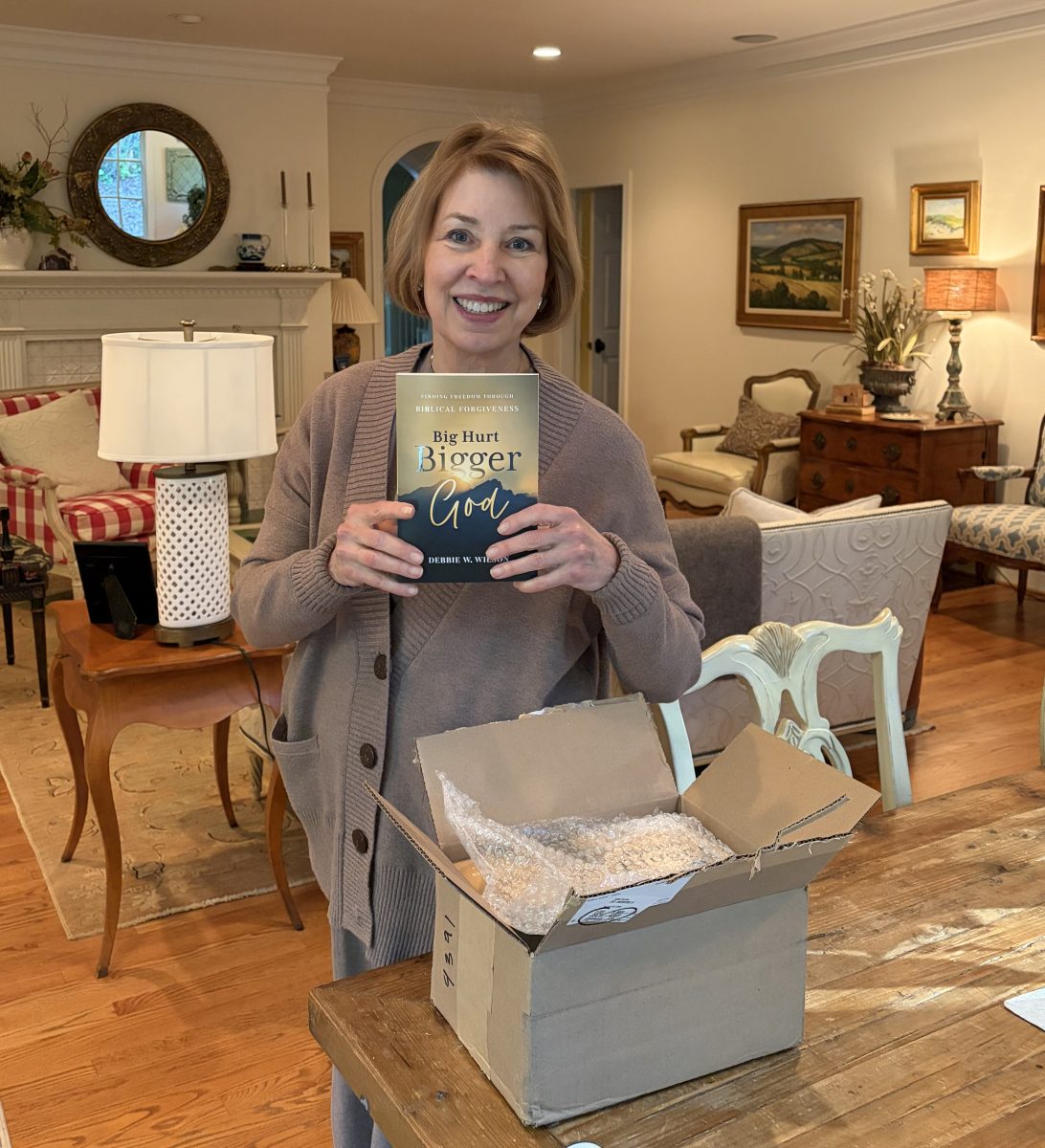 Debbie unpacking the first copy of Big Hurt, Bigger God